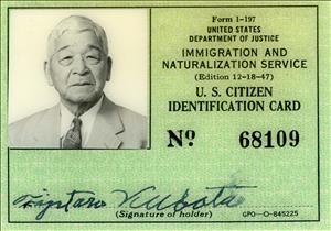 A card with a photograph of a Japanese man in a suit, a signature, and the text U.S. Citizen Identification Card 68109